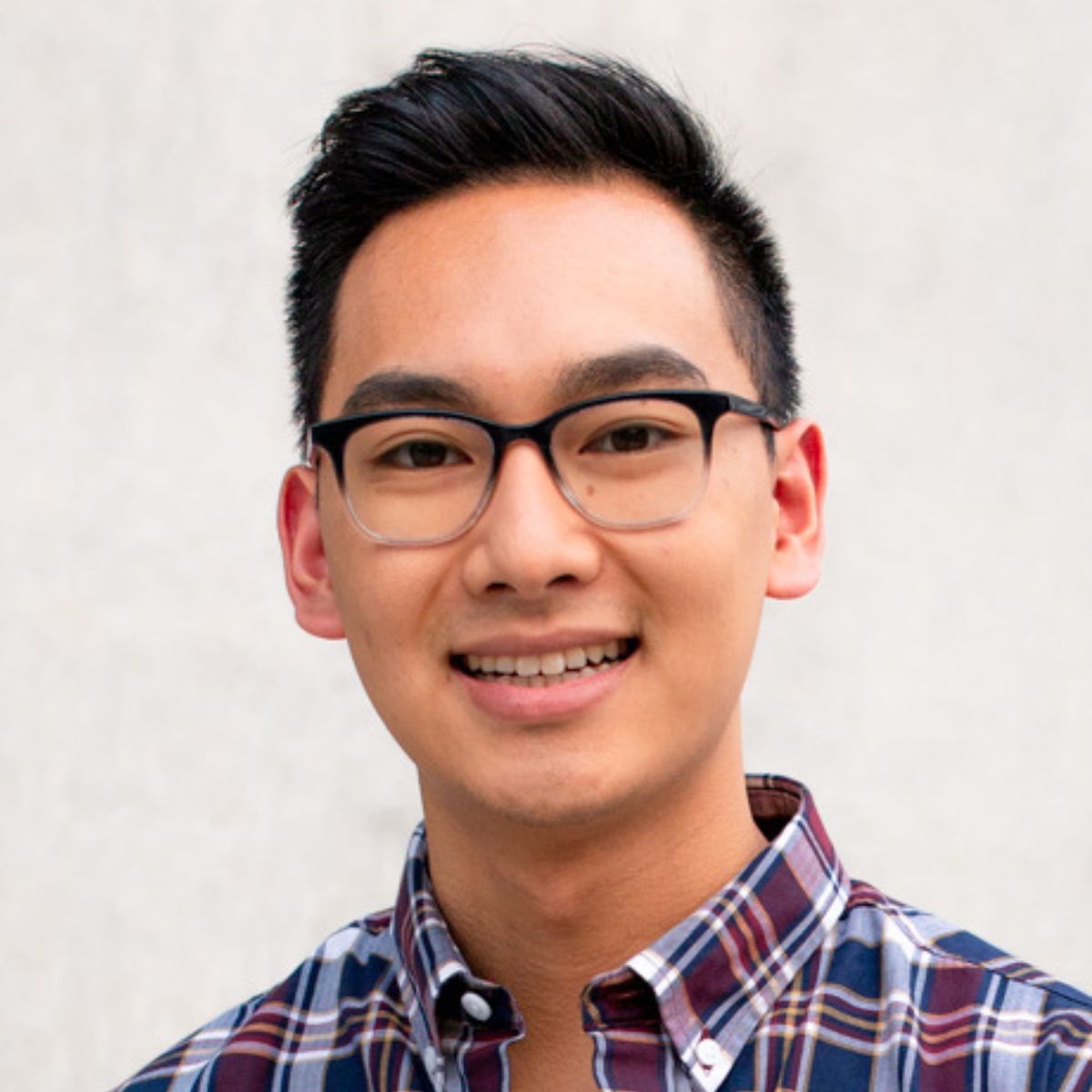 Headshot of David Em.